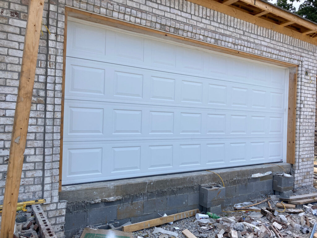 White short panel traditional garage door 