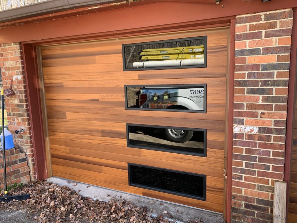 Modern plank faux wood garage door with windows 