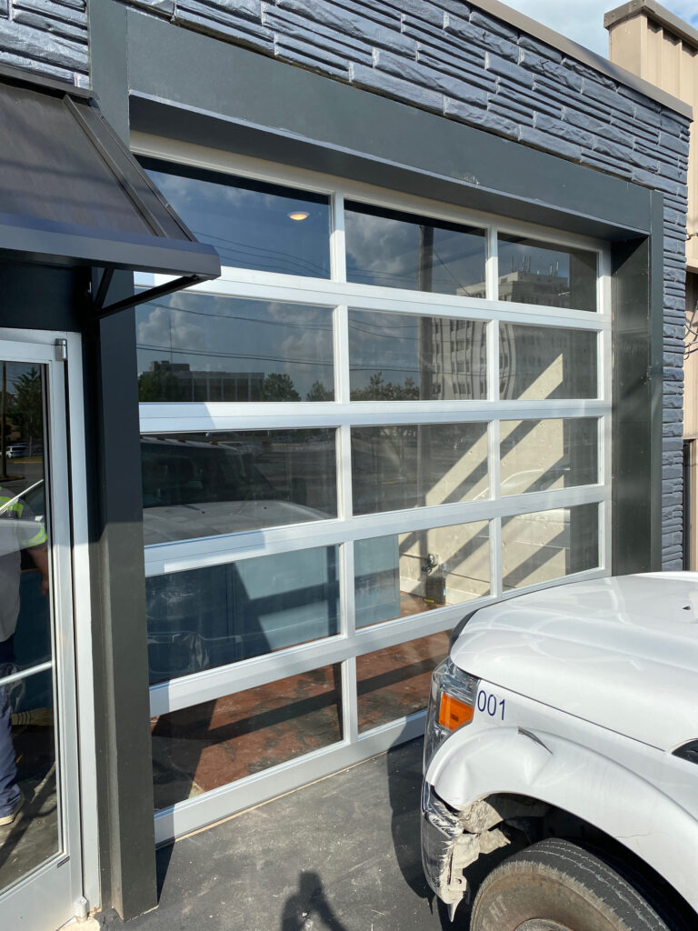 Glass  garage door with white frames