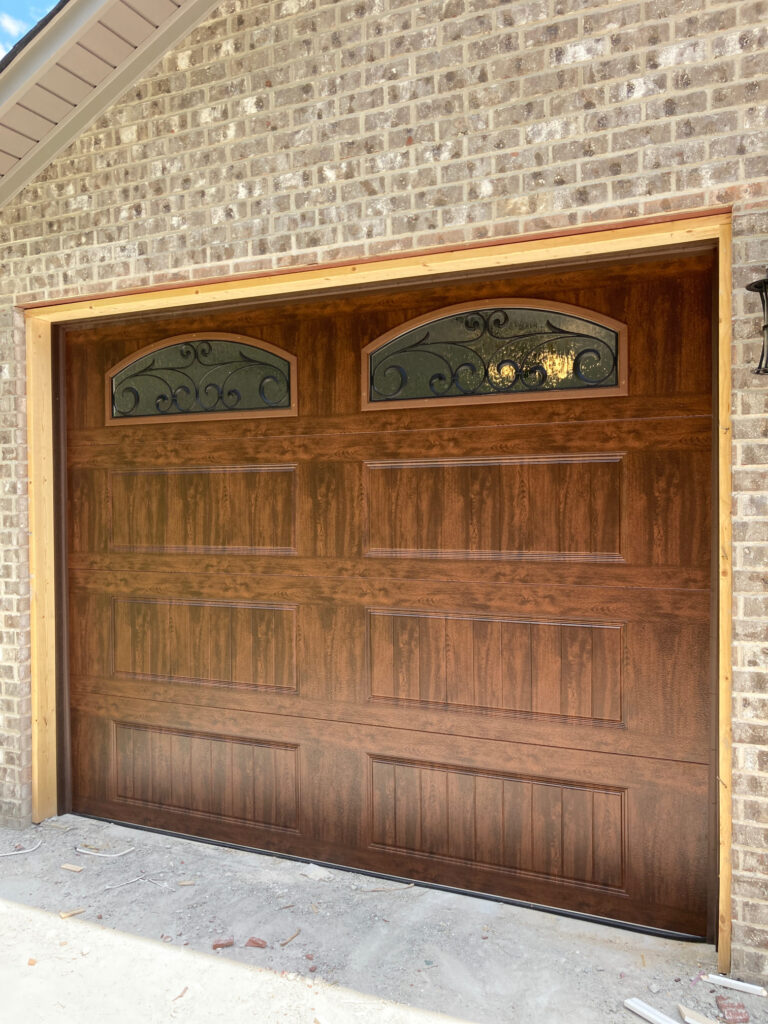 Faux wood garage door with windows. 