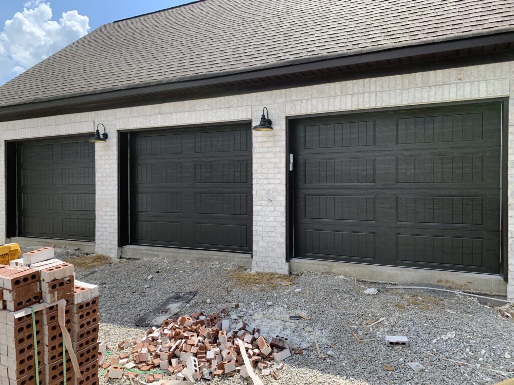 Black garage door installed by Shoals Overhead Doors