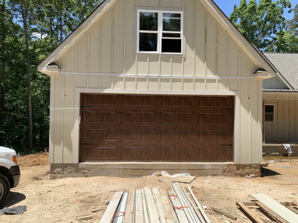 Faux wood carriage garage door