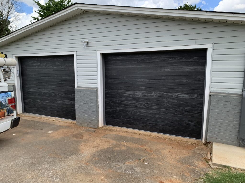 Black modern plank wood garage doors