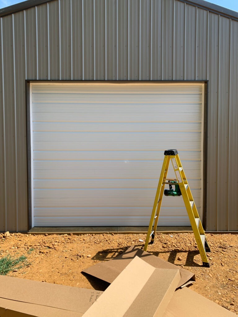 White plank-style garage door. 