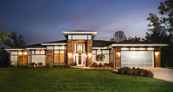 Contemporary home with white-framed glass garage door 