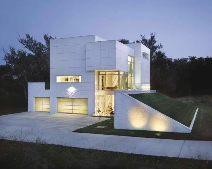 White modern home with frosted glass garage door