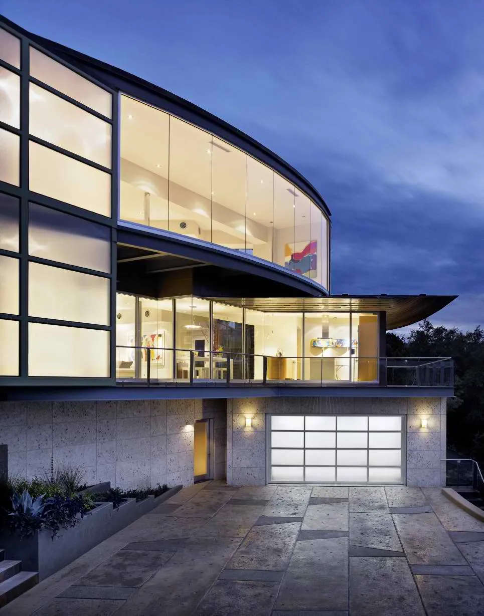 Contemporary home with glass garage door