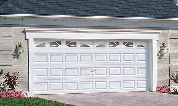 White classic traditional garage door with curved windows 