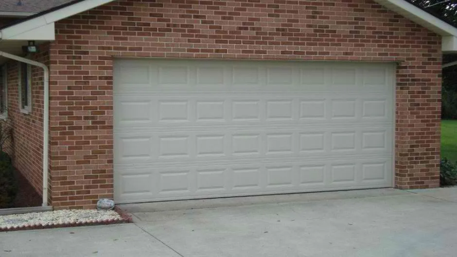 White standard traditional garage door with short panels 