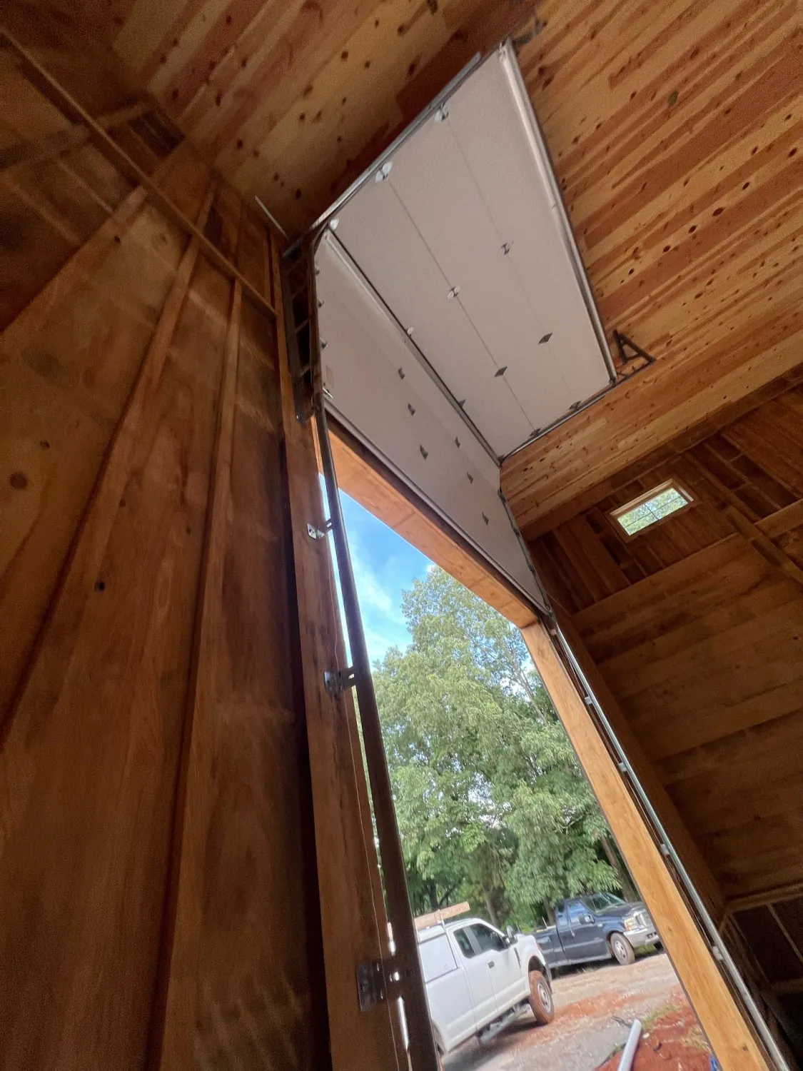 High-lift track system on a commercial overhead door